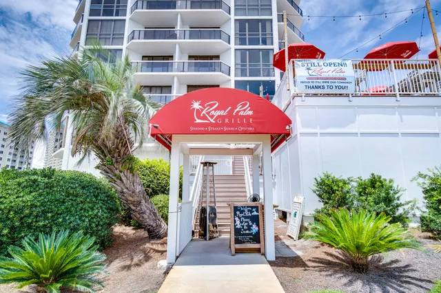 a small pool is sitting in front of a building
