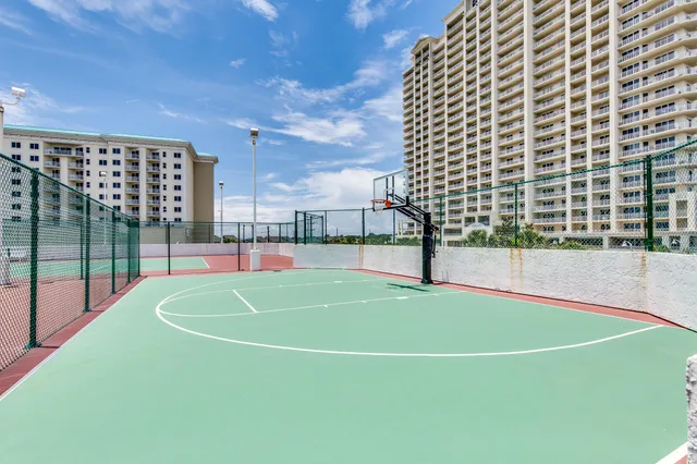 a living room with furniture and a glass door