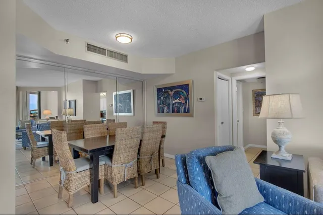 a view of a room with a large window and chair