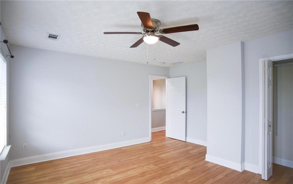 6616 Splashwater Drive Flowery Branch, GA 30542 - Photo 19 of 33 a view of an empty room