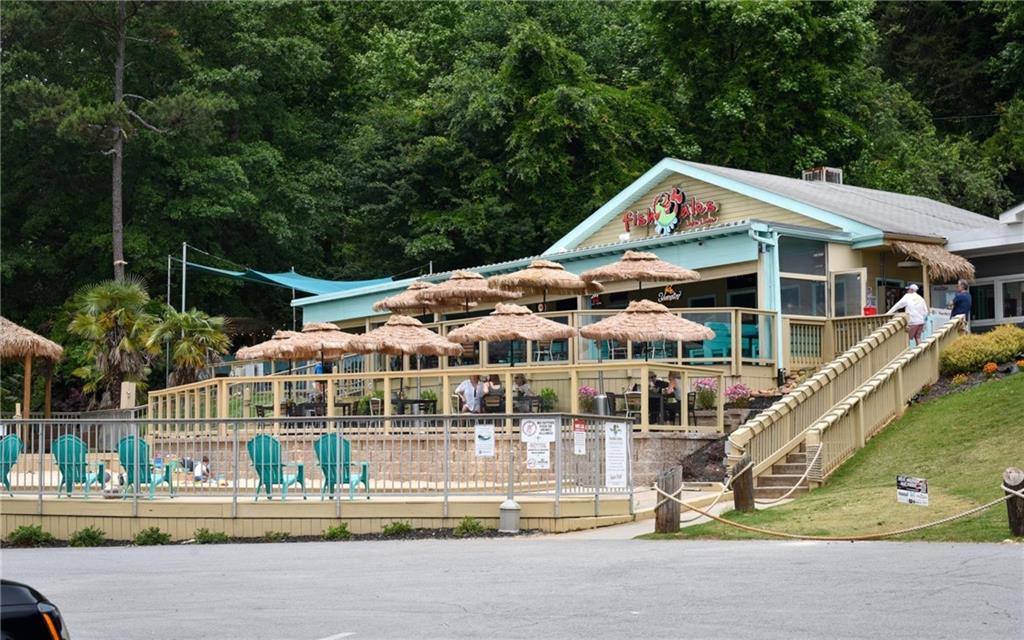 6616 Splashwater Drive Flowery Branch, GA 30542 - Photo 24 of 33 a view of house with outdoor space and swimming pool