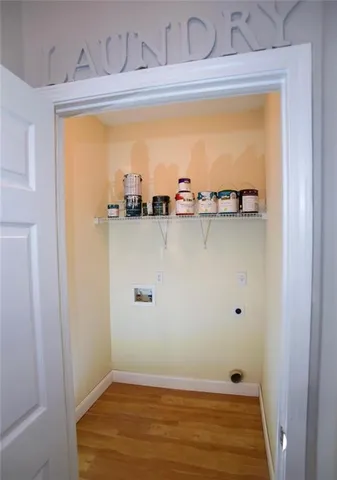 a view of walk in closet with empty room