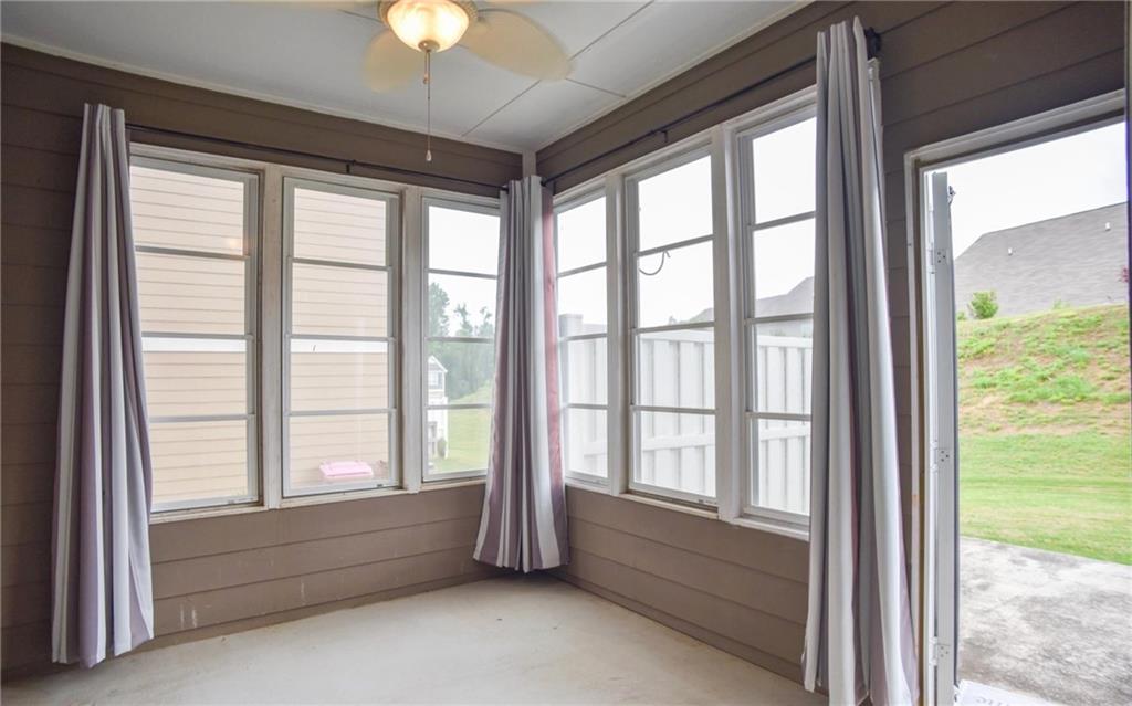 6616 Splashwater Drive Flowery Branch, GA 30542 - Photo 10 of 33 a view of room with window and chandelier