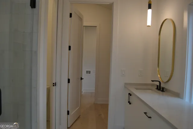 a bathroom with a sink and a mirror
