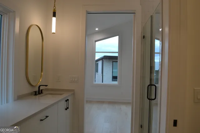 a bathroom with a sink and mirror