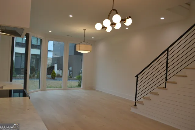 a view of a hallway with chandelier