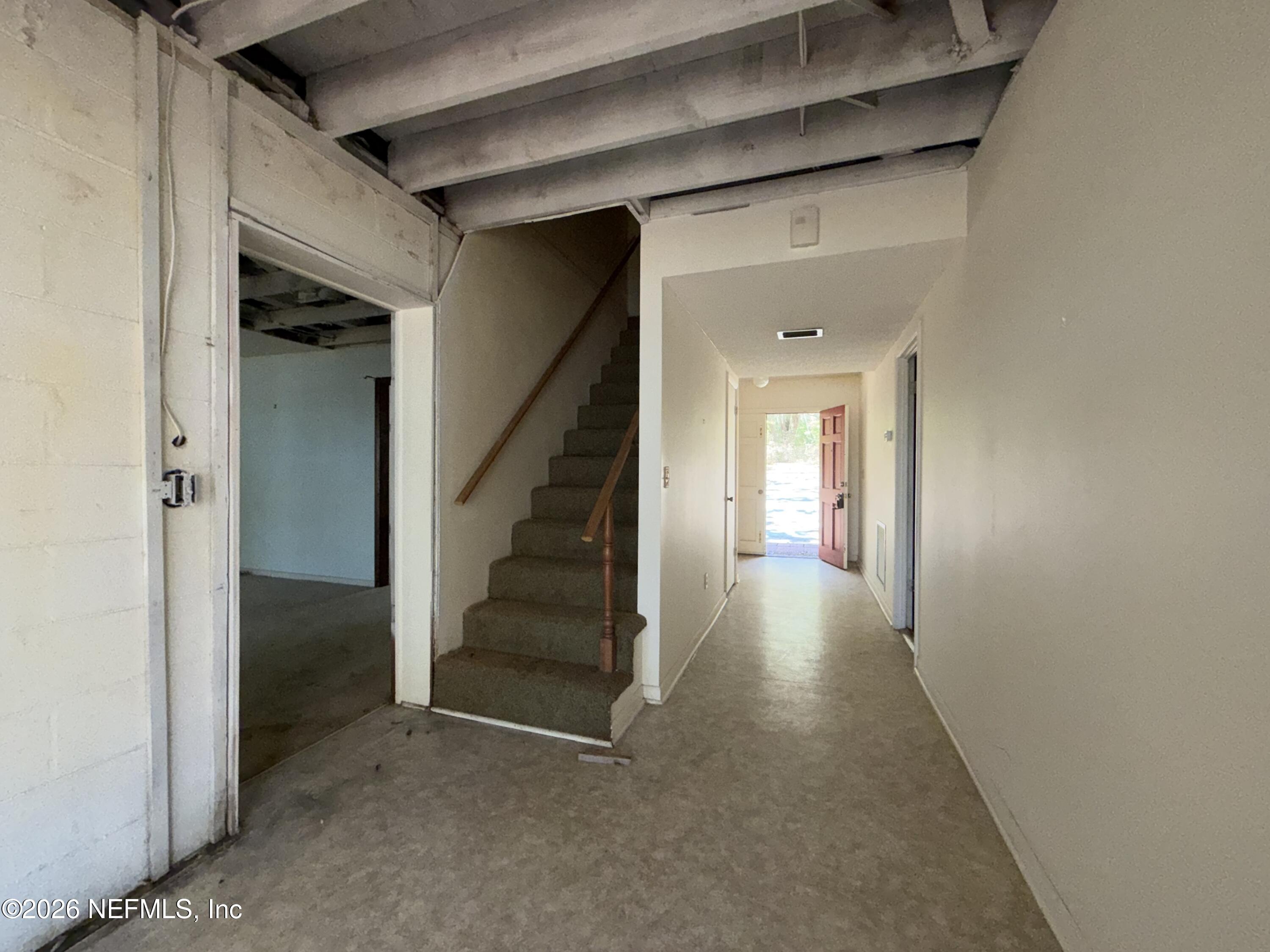 5943 White Sands Road Keystone Heights, FL 32656 - Photo 13 of 18 a view of a hallway with staircase