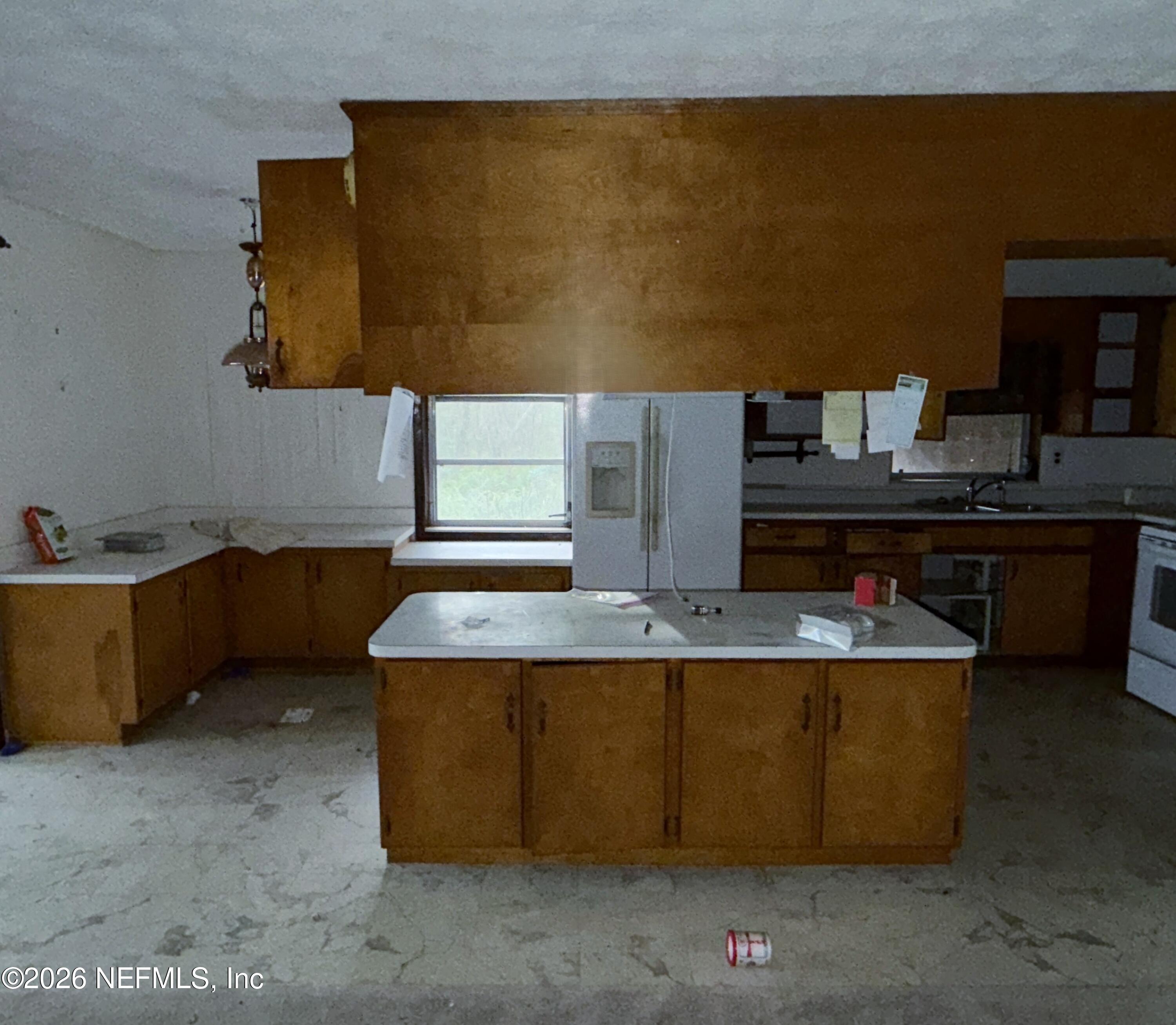 5943 White Sands Road Keystone Heights, FL 32656 - Photo 10 of 18 a kitchen with a sink a counter top space and cabinets