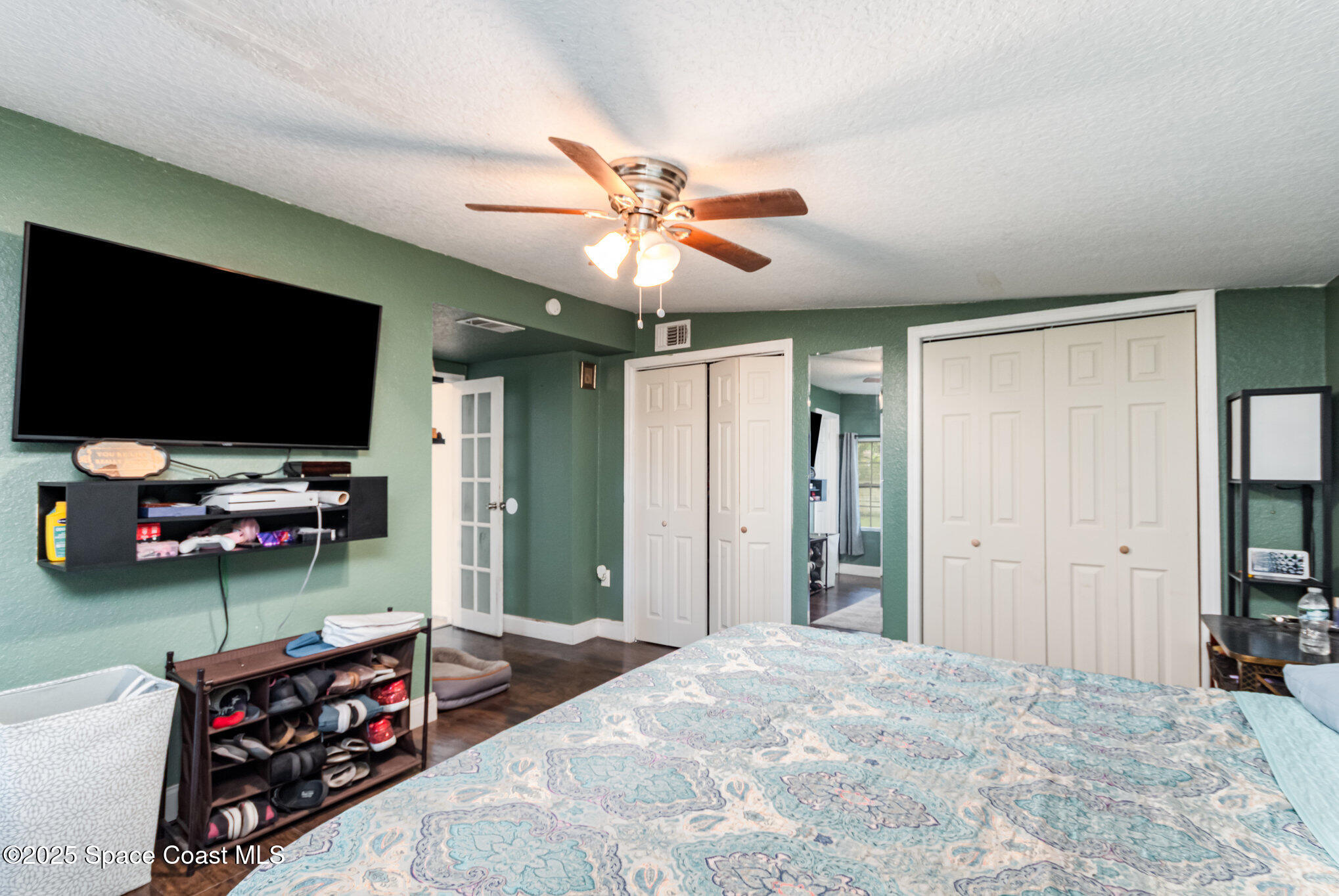 2004 High Street Leesburg, FL 34748 - Photo 16 of 30 a bedroom with furniture and a flat screen tv