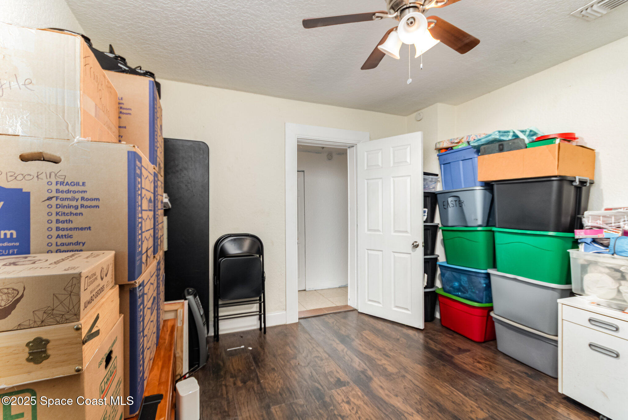 2004 High Street Leesburg, FL 34748 - Photo 25 of 30 a bedroom with a bed and a mirror
