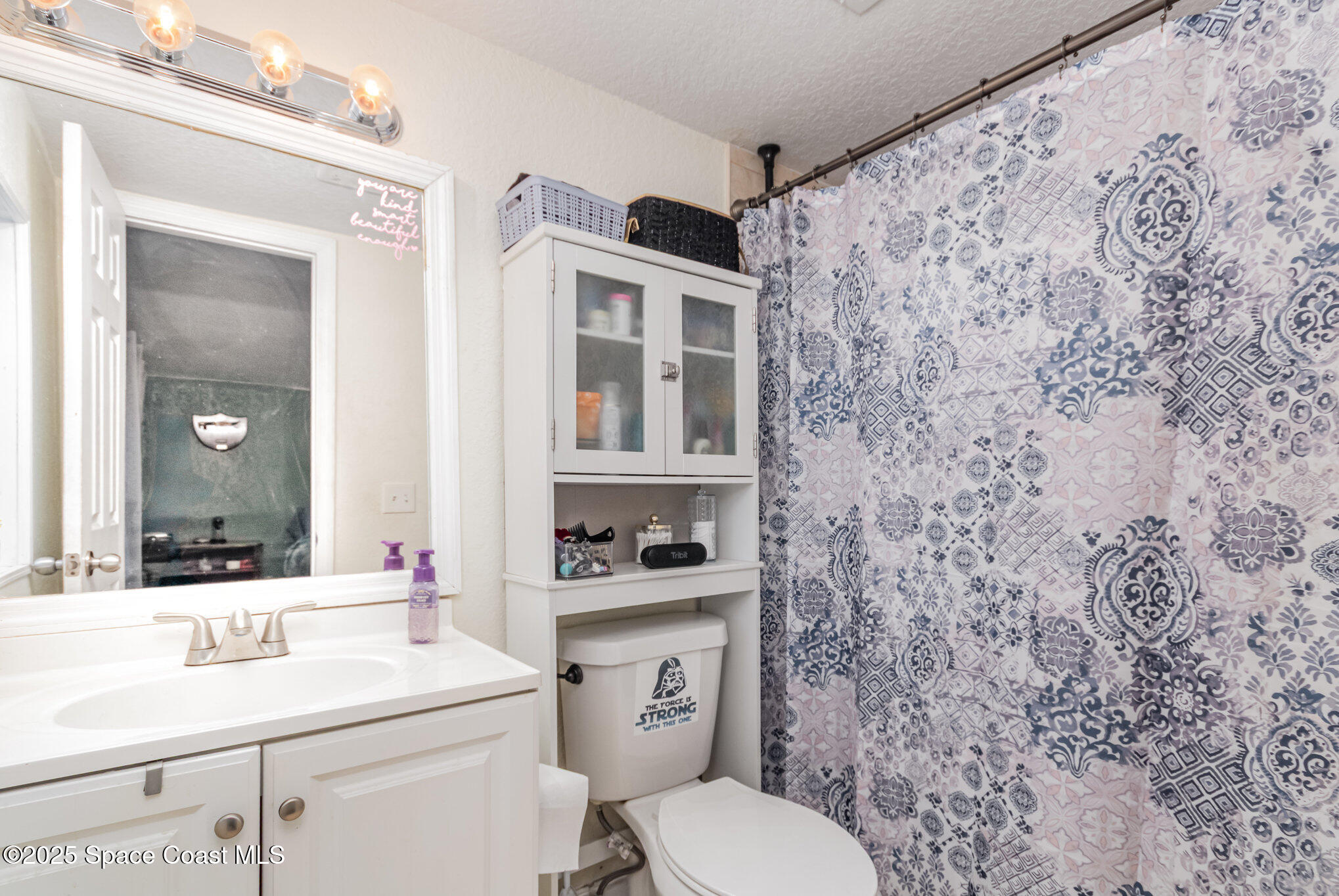 2004 High Street Leesburg, FL 34748 - Photo 26 of 30 a bathroom with a sink toilet vanity and mirror