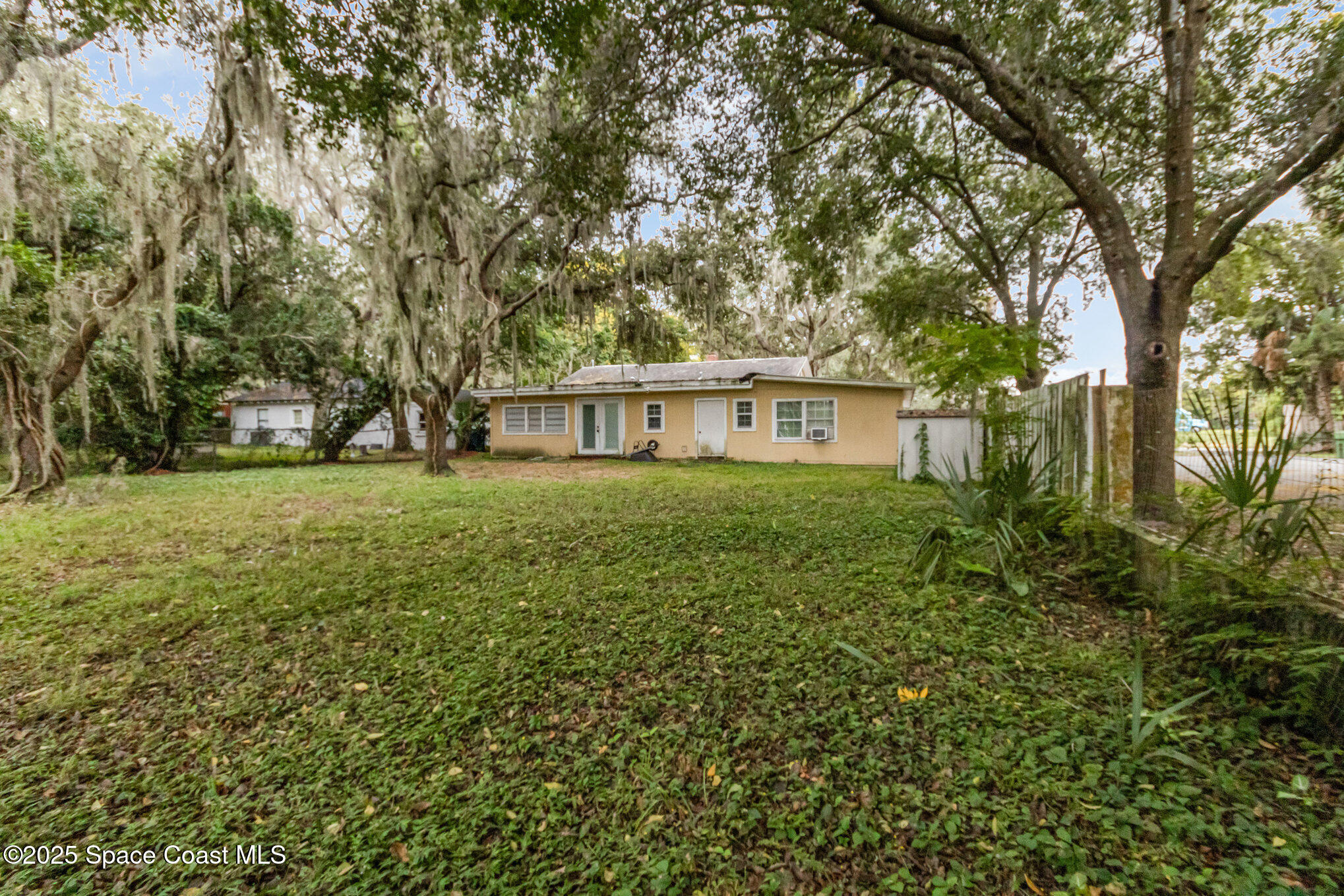 2004 High Street Leesburg, FL 34748 - Photo 29 of 30 a view of house with a big yard and large trees