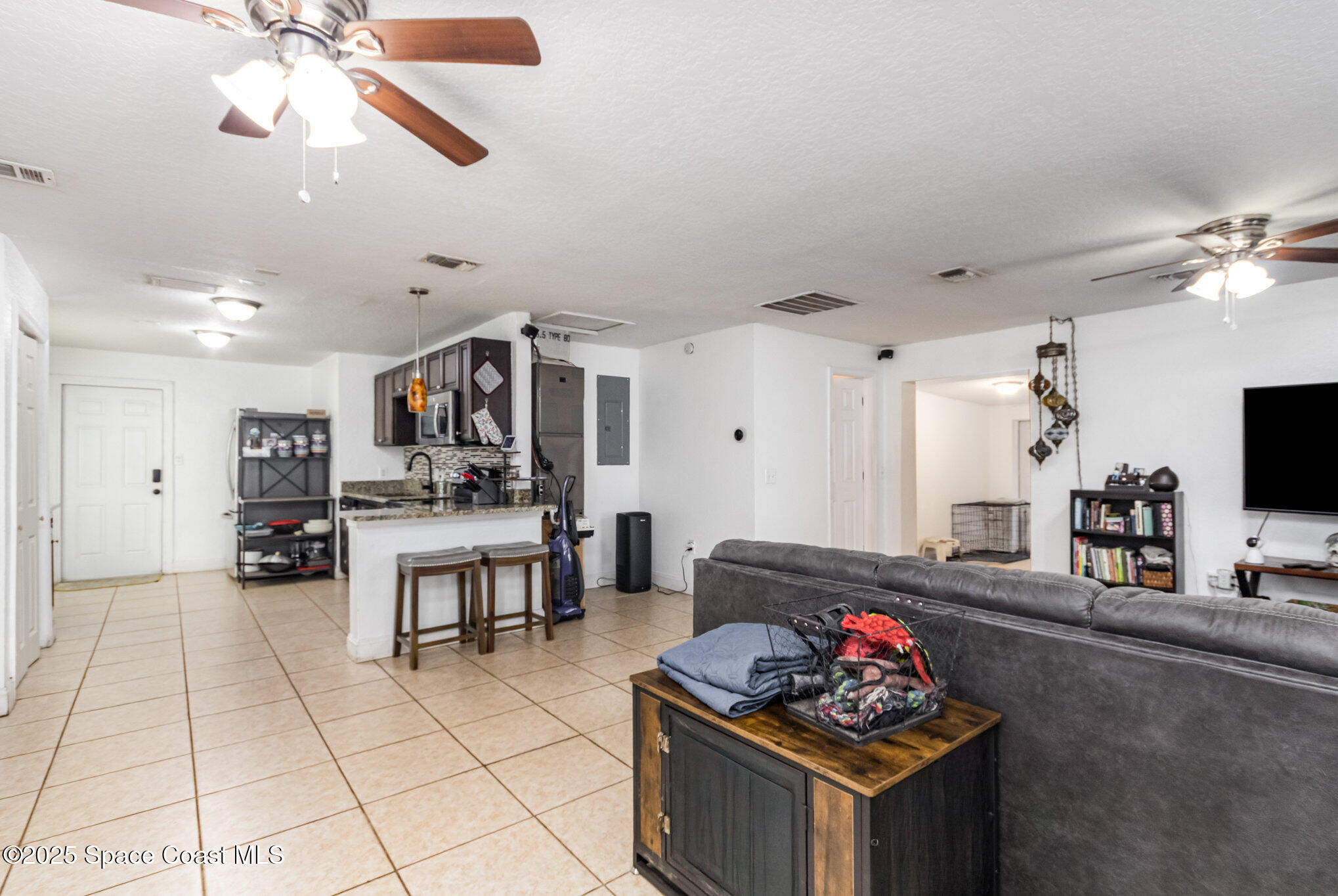 2004 High Street Leesburg, FL 34748 - Photo 7 of 30 a living room with furniture and a flat screen tv