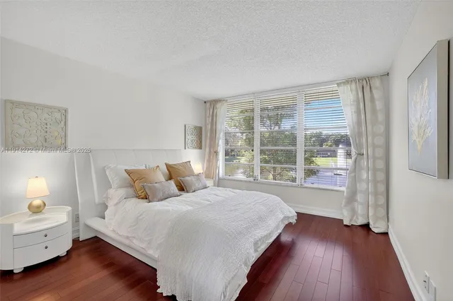 a bed room with a bed and a window