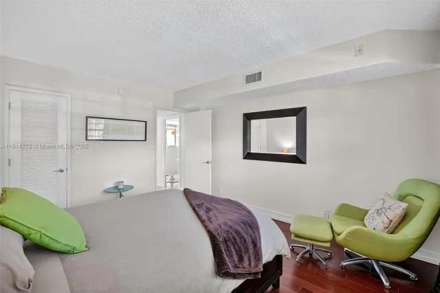 a living room with furniture and a chair