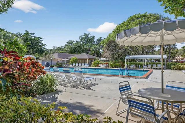 a view of a chairs and table in the terrace