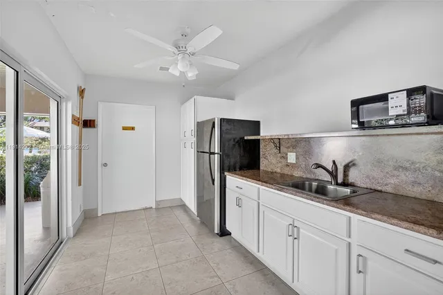 an aerial view of a swimming pool patio and outdoor seating