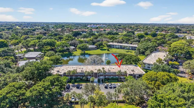 an aerial view of a house with a lake view