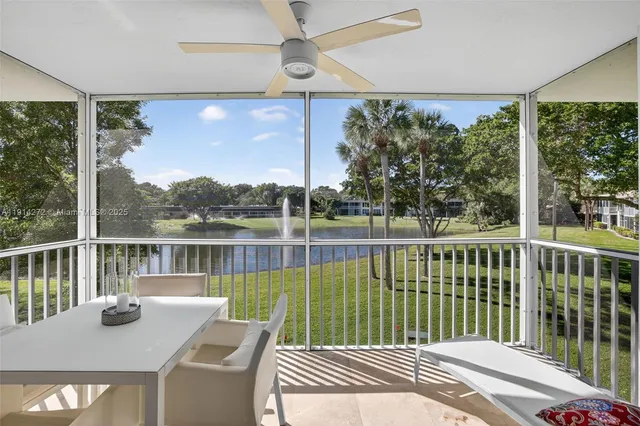 a view of a balcony with lake view and wooden floor