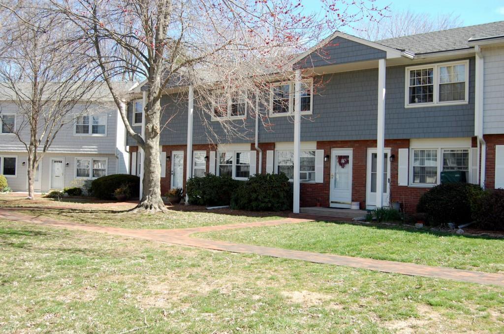 25 Riverside Drive, Unit A14 Clinton, CT 06413 - Photo 1 of 1 a view of a house with a yard and large tree