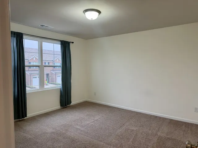 a bathroom with a shower and a toilet