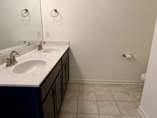 a bathroom with a glass shower door
