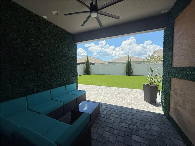 a view of a backyard of the house