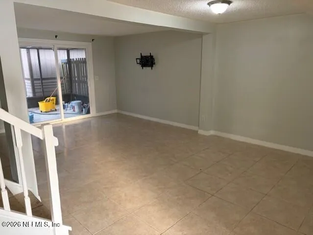 a view of an empty room with a fan