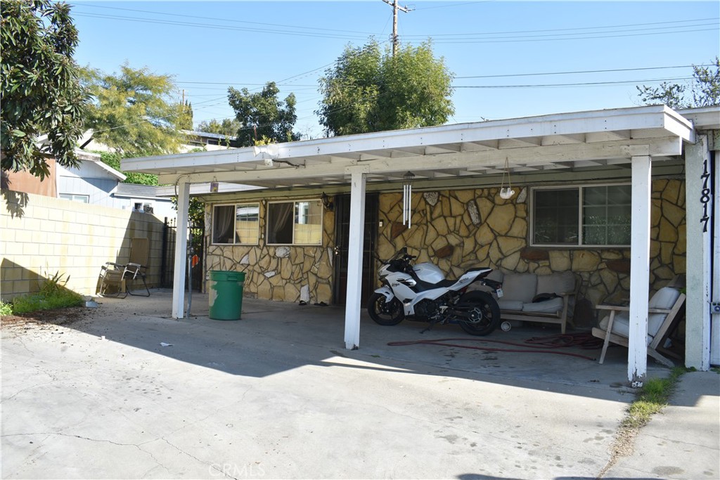 a view of a patio with table and chairs and potted plants