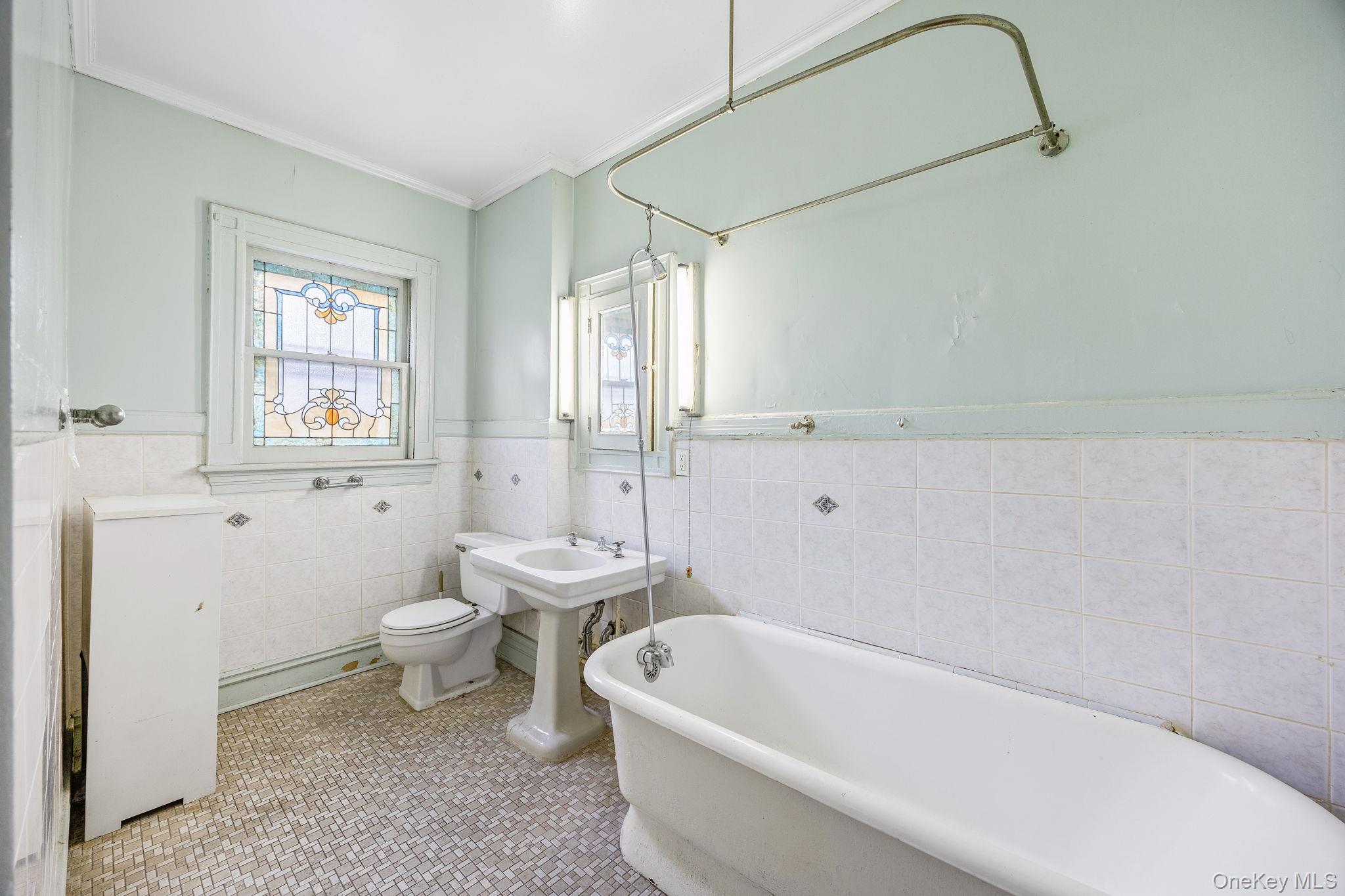 770 Argyle Road Brooklyn, NY 11230 - Photo 18 of 28 a bath room with a toilet a bath tub and a shower
