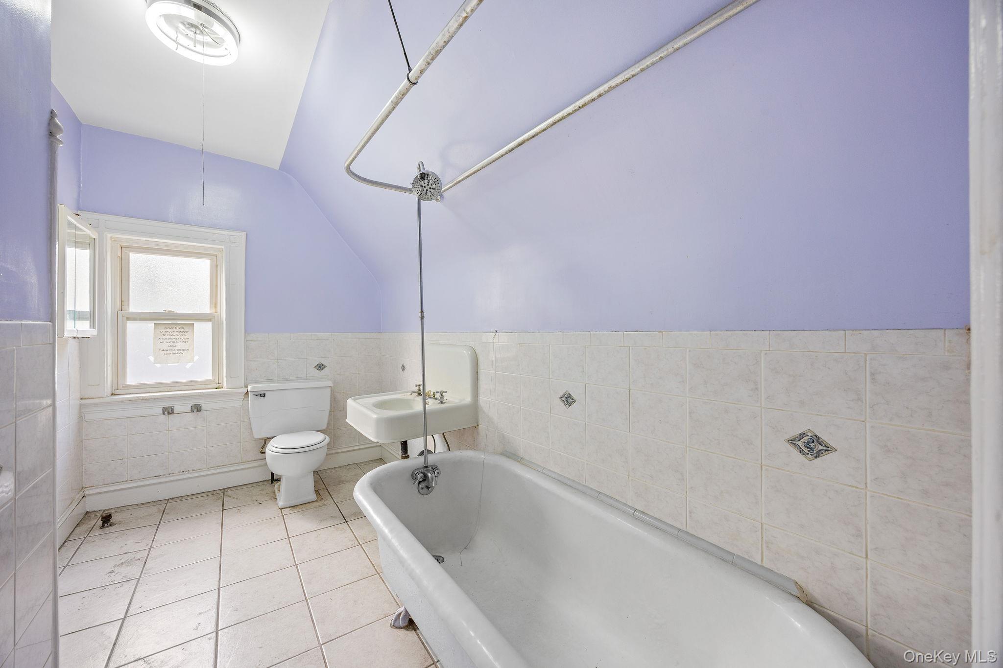 770 Argyle Road Brooklyn, NY 11230 - Photo 20 of 28 a bathroom with a tub sink and toilet