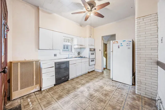 a kitchen with a cabinets appliances and a counter top space