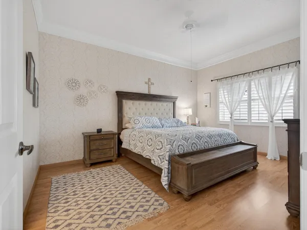 a bedroom with a bed and window