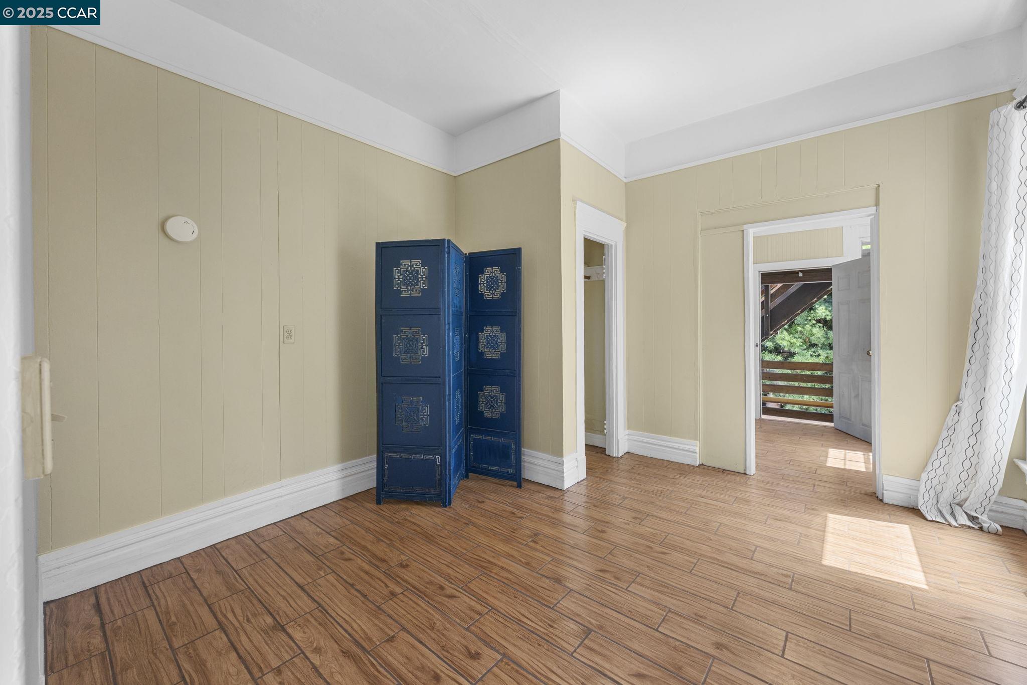 1220 Chestnut Street Alameda, CA 94501 - Photo 14 of 29 a view of an empty room with wooden floor and a window