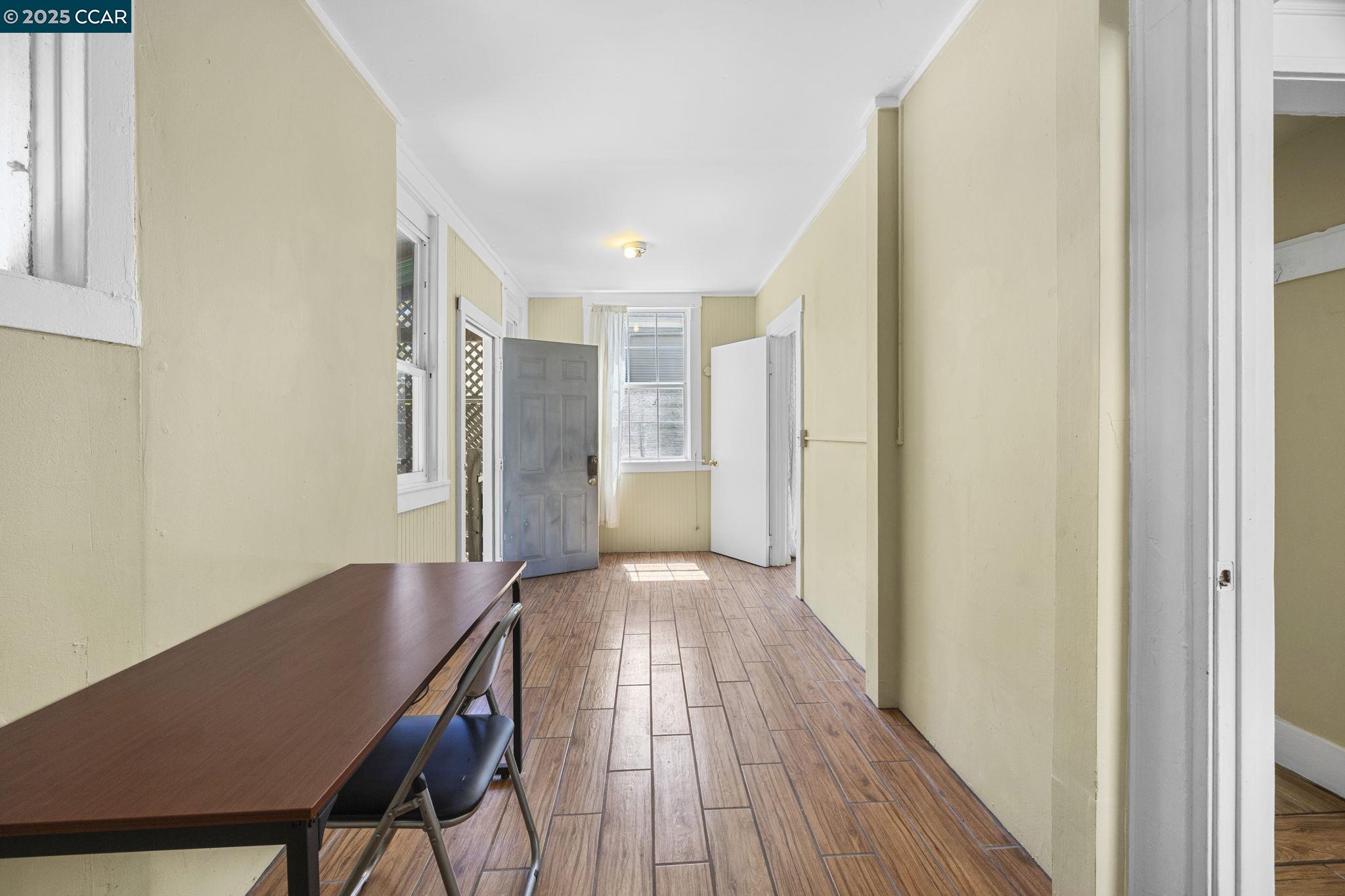 1220 Chestnut Street Alameda, CA 94501 - Photo 17 of 29 a view of a hallway with wooden floor and staircase