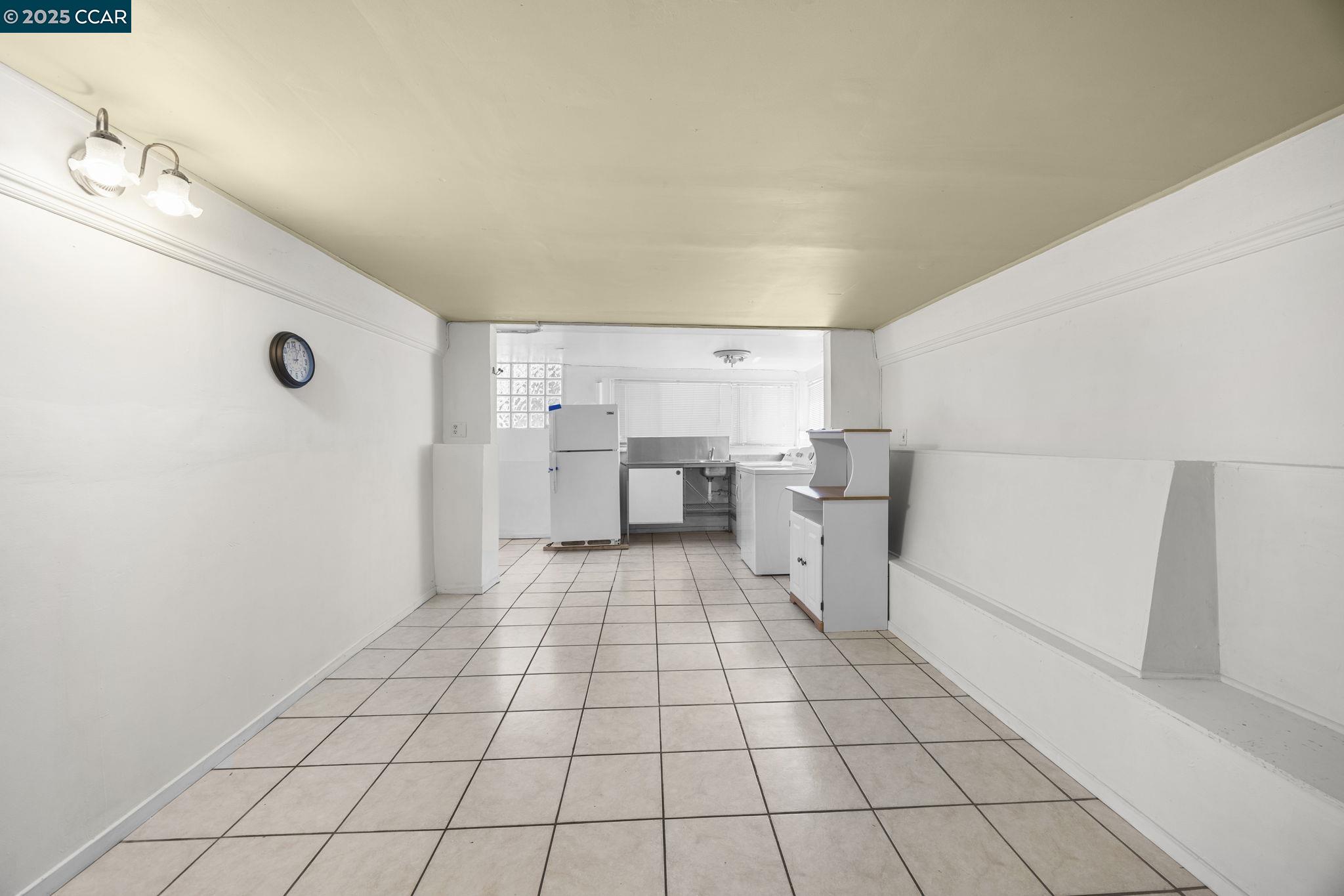 1220 Chestnut Street Alameda, CA 94501 - Photo 24 of 29 a view of a kitchen with a sink and white cabinets