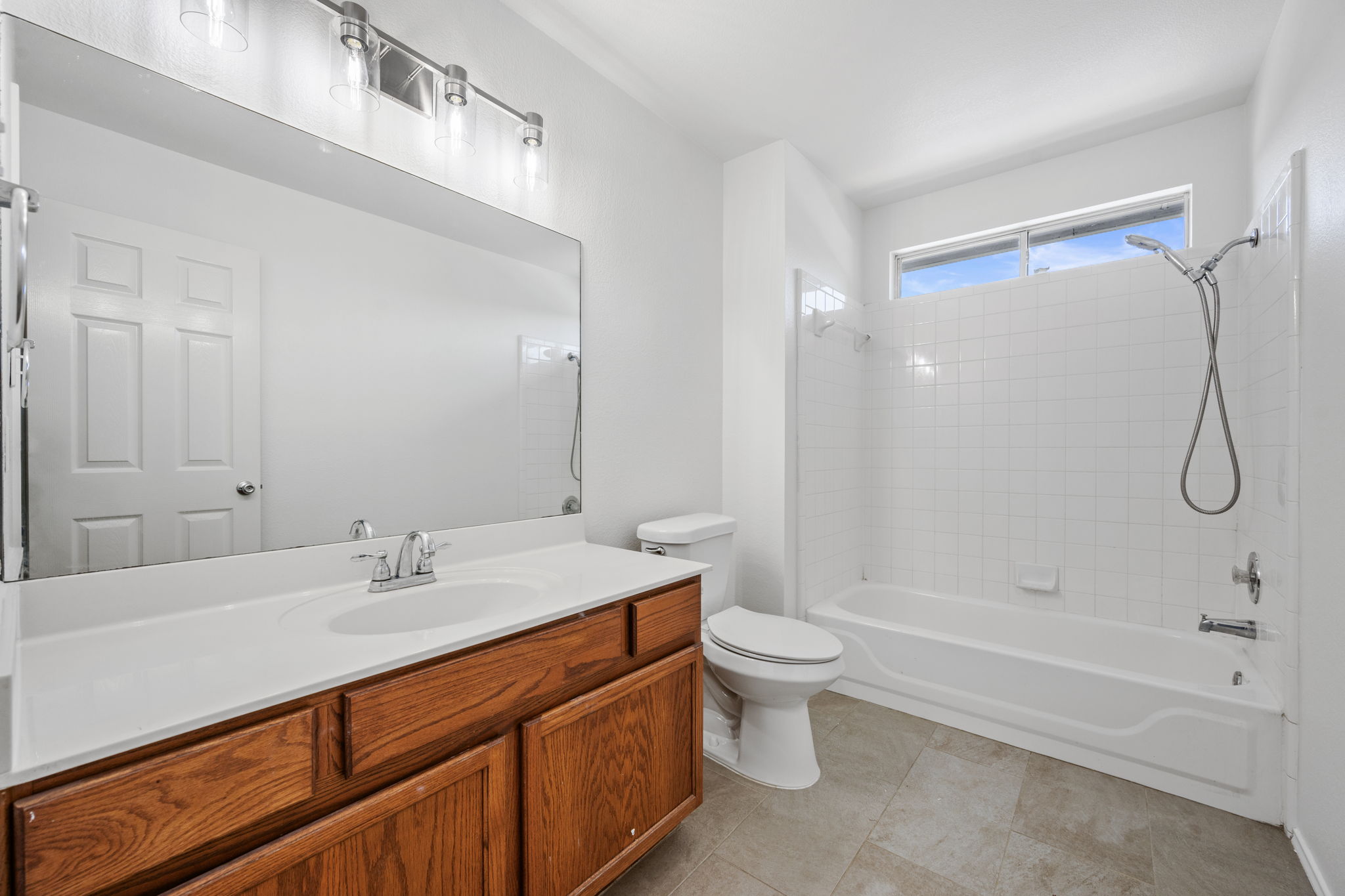 2440 Madeline Loop Cedar Park, TX 78613 - Photo 26 of 33 Full bathroom with vanity, shower / bath combination, and light tile patterned flooring