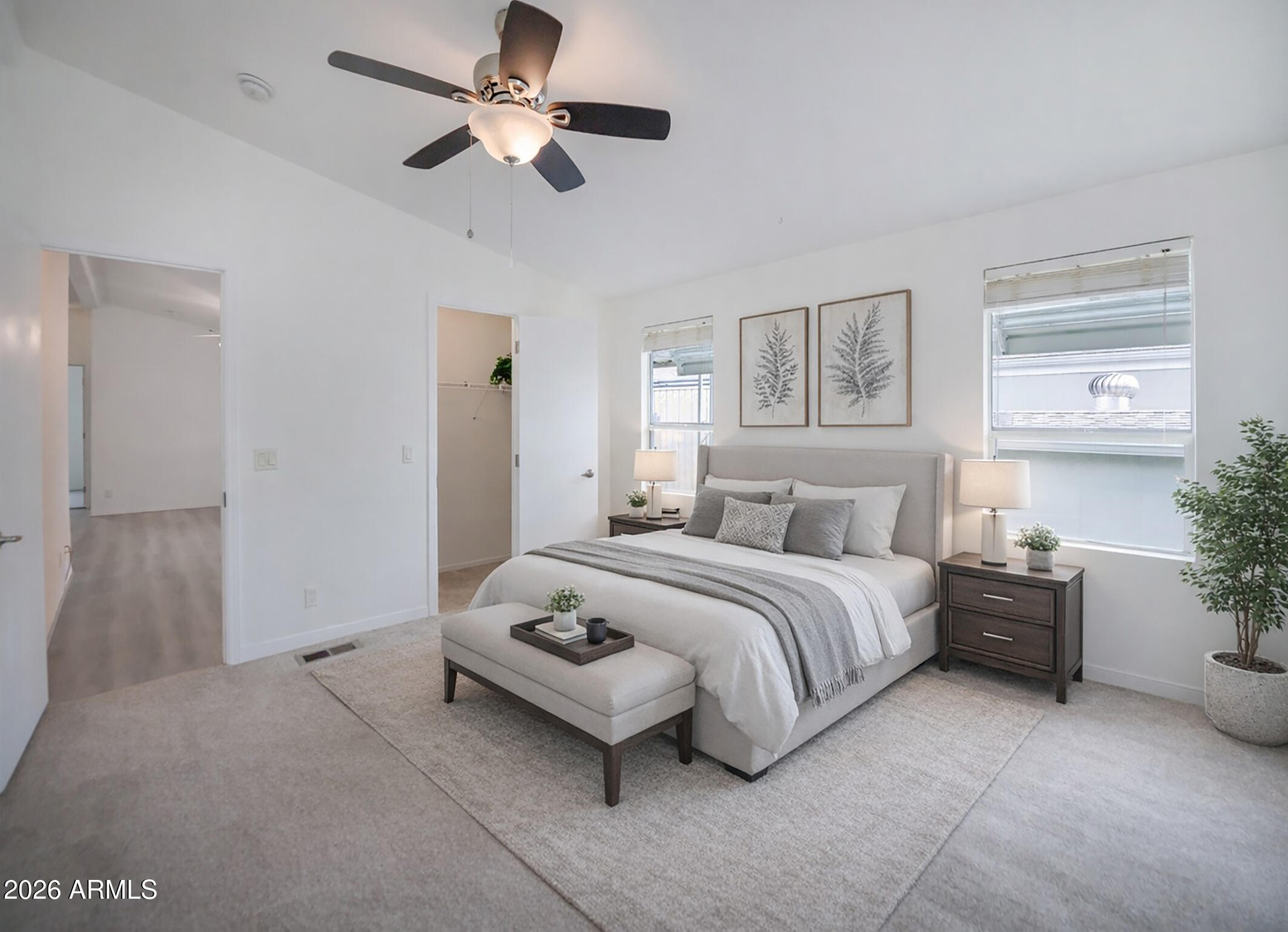 11250 East State Rte 69, Unit 1125 Dewey, AZ 86327 - Photo 18 of 45 a spacious bedroom with a bed and a chandelier