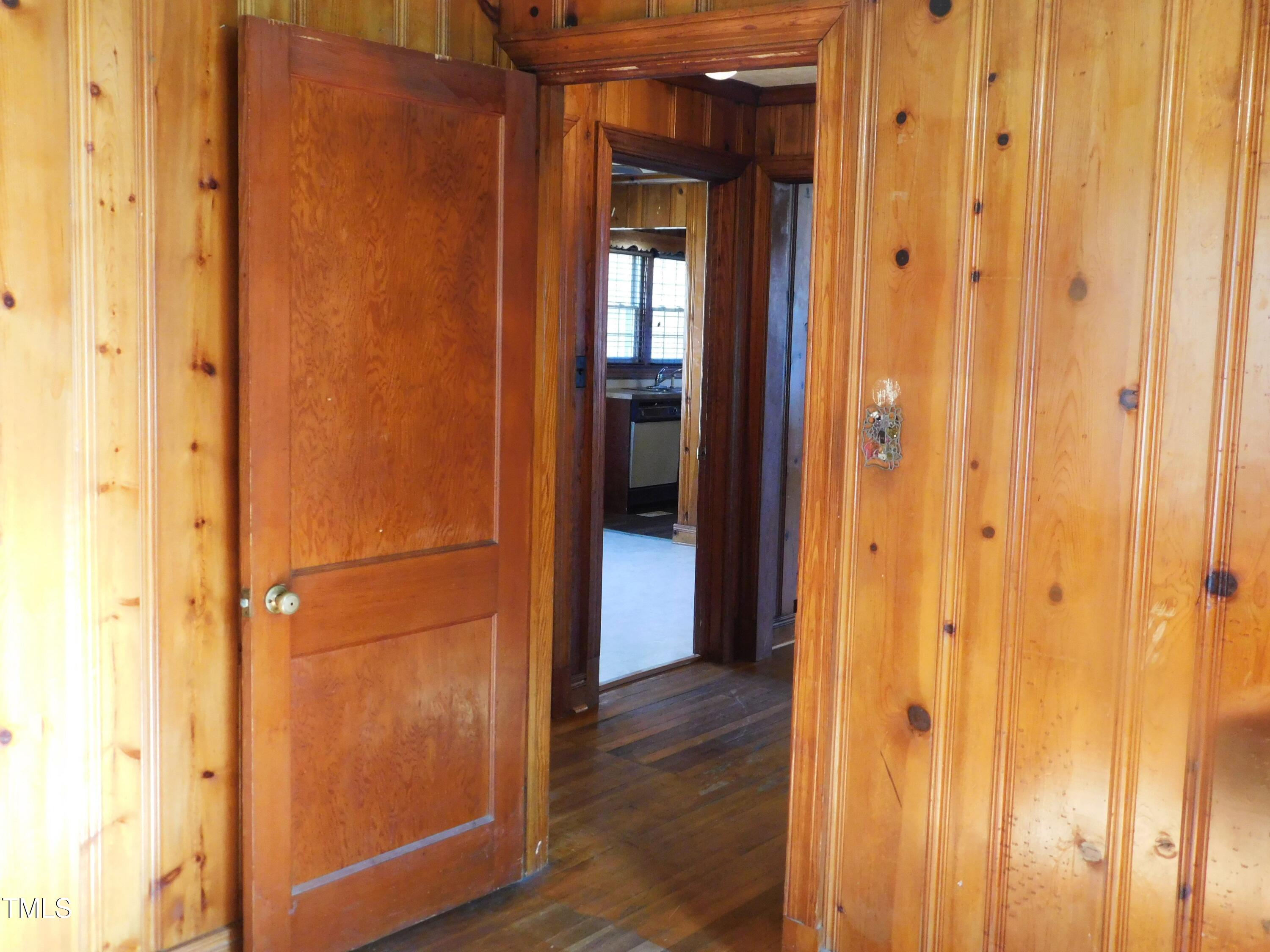 477 Providence Road Roxboro, NC 27573 - Photo 13 of 32 a view of a hallway with wooden floor
