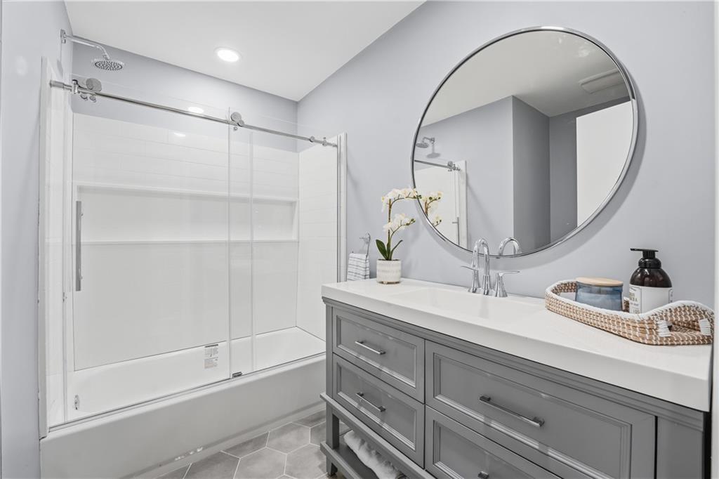 17 Shenango Road New Castle, PA 16105 - Photo 14 of 16 a bathroom with a double vanity sink mirror and shower