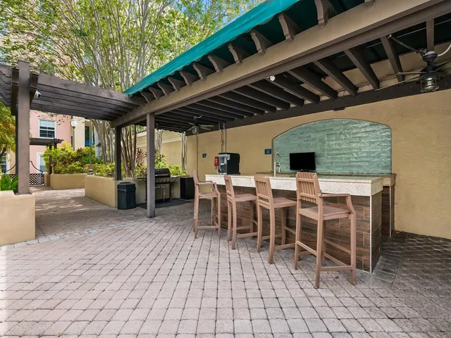 a view of a patio with table and chairs
