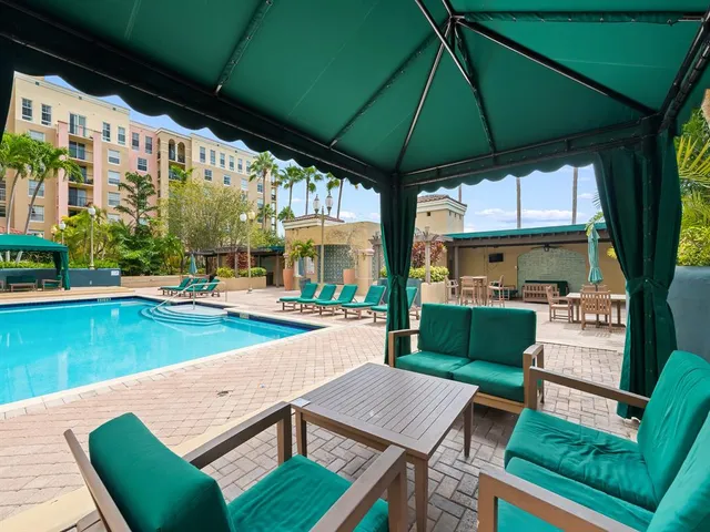 a view of an chairs and table in the patio