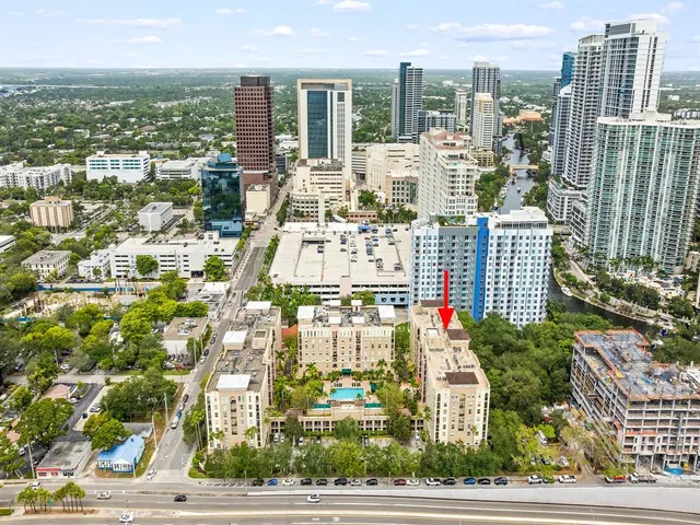 a view of a building with a garden and a building