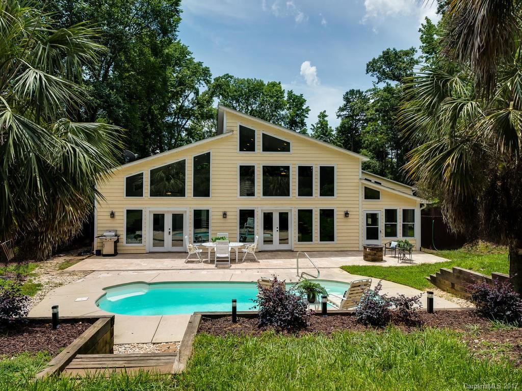 101 Heathwood Road Charlotte, NC 28211 - Photo 1 of 24 a front view of a building with garden and trees