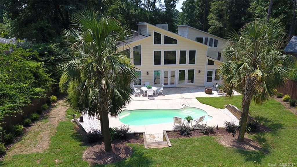 101 Heathwood Road Charlotte, NC 28211 - Photo 2 of 24 a swimming pool with outdoor seating and yard