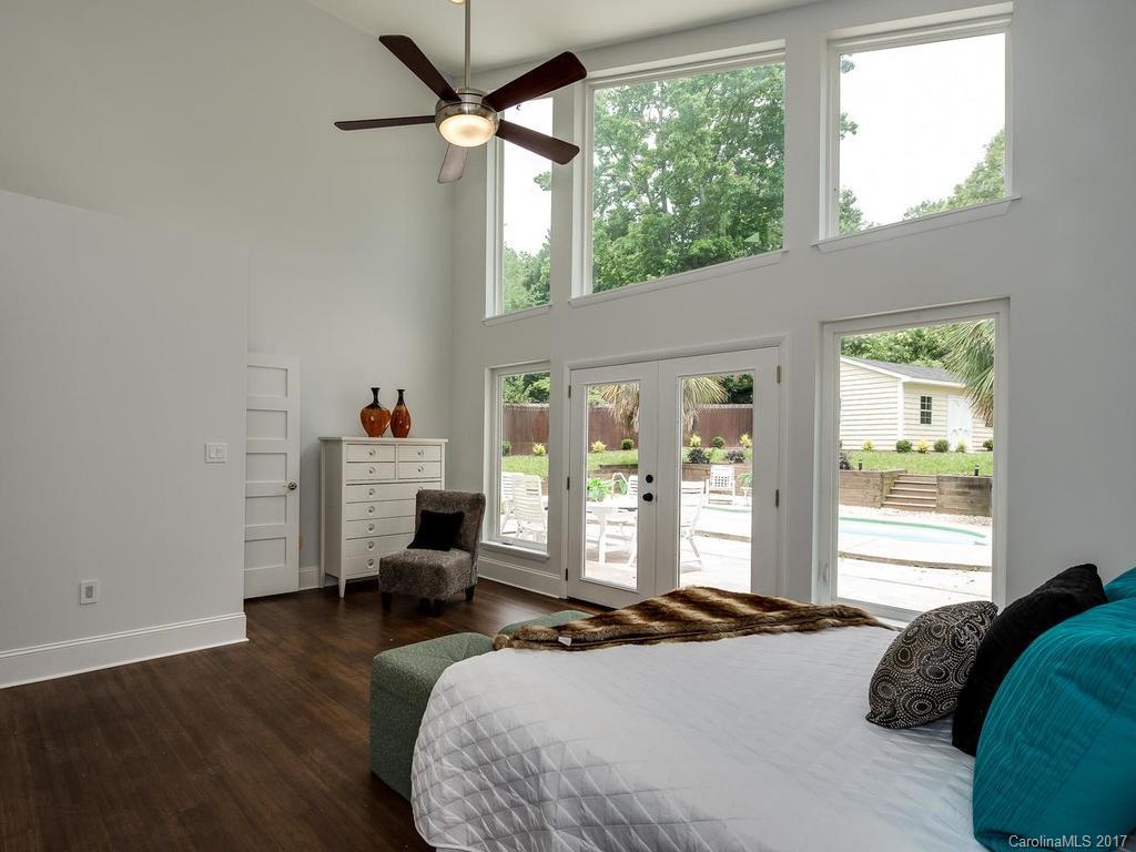101 Heathwood Road Charlotte, NC 28211 - Photo 11 of 24 a bedroom with a large bed and a large window