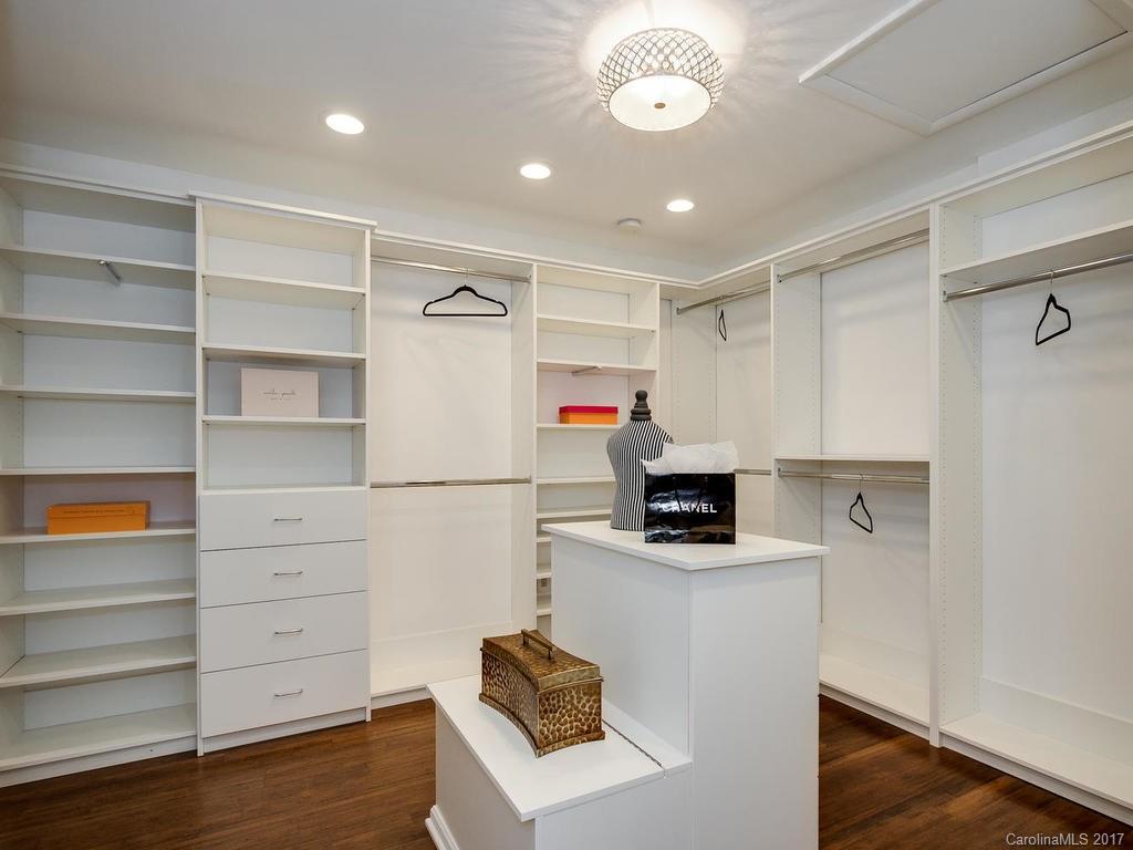 101 Heathwood Road Charlotte, NC 28211 - Photo 15 of 24 a kitchen with a refrigerator a stove and wooden floor