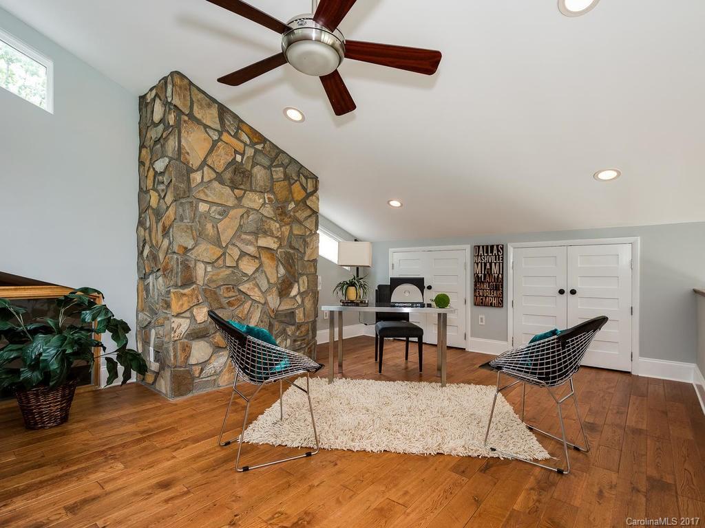 101 Heathwood Road Charlotte, NC 28211 - Photo 22 of 24 a living room with furniture and a wooden floor