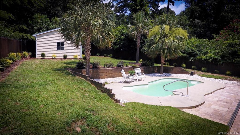 101 Heathwood Road Charlotte, NC 28211 - Photo 23 of 24 a view of a house with swimming pool and a yard