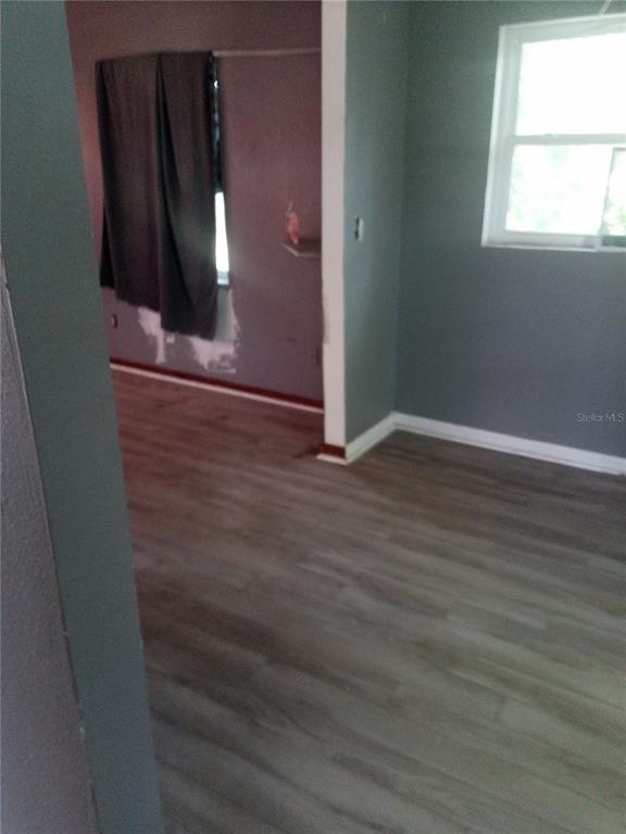 2822 South Dean Road Orlando, FL 32825 - Photo 22 of 43 an empty room with wooden floor